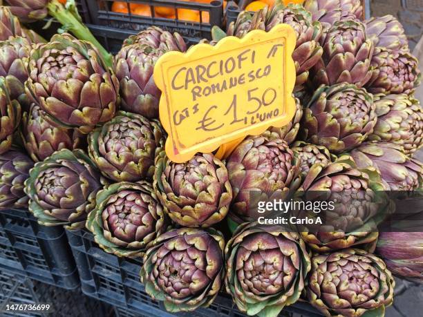 fresh artichokes on sale at market - campo de fiori stock pictures, royalty-free photos & images