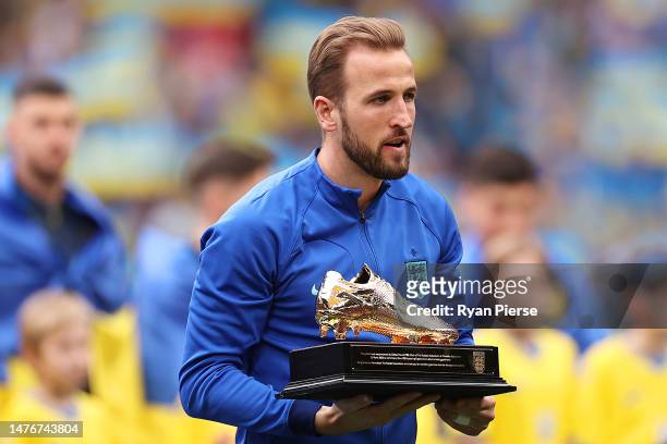 Harry Kane of England poses with their Golden Boot trophy after becoming the England All Time Top Goalscorer after they scored their 54th England...