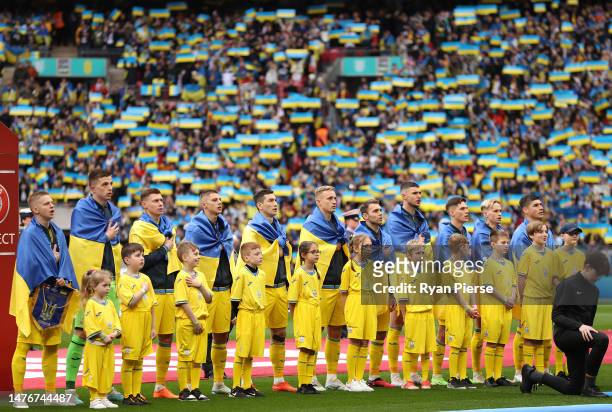 Players of Ukraine line up as fans show their support prior to the UEFA EURO 2024 qualifying round group C match between England and Ukraine at...
