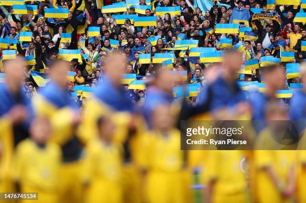 Fans of Ukraine hold up banners to show their support prior to the UEFA EURO 2024 qualifying round group C match between England and Ukraine at...
