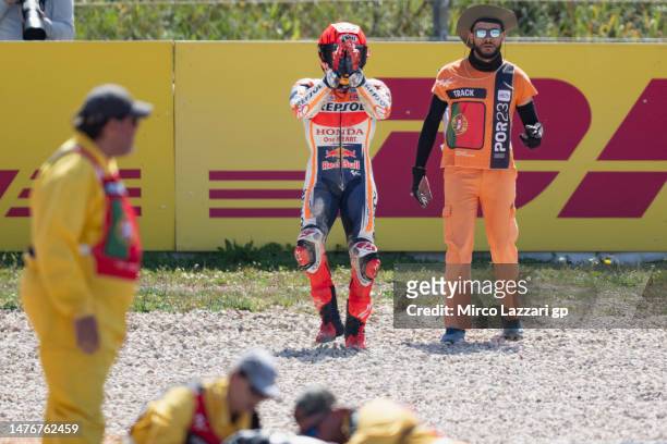 Marc Marquez of Spain and Repsol Honda Team apologizes to Miguel Oliveira of Portugal and Cryptodata RNF MotoGP Team and fans after crashed out...