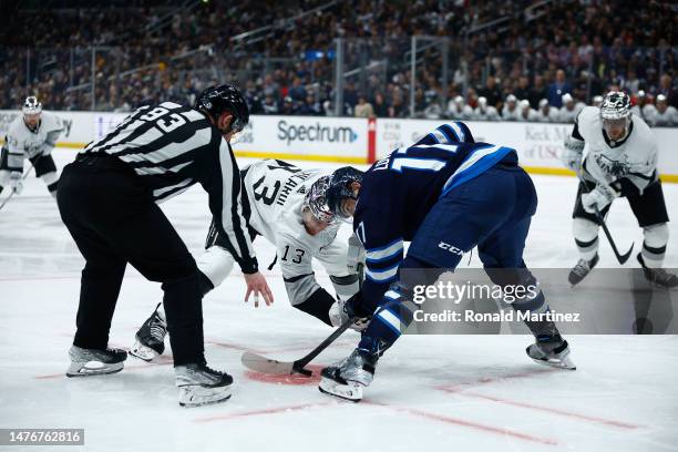 Gabriel Vilardi of the Los Angeles Kings and Adam Lowry of the Winnipeg Jets in the second period at Crypto.com Arena on March 25, 2023 in Los...