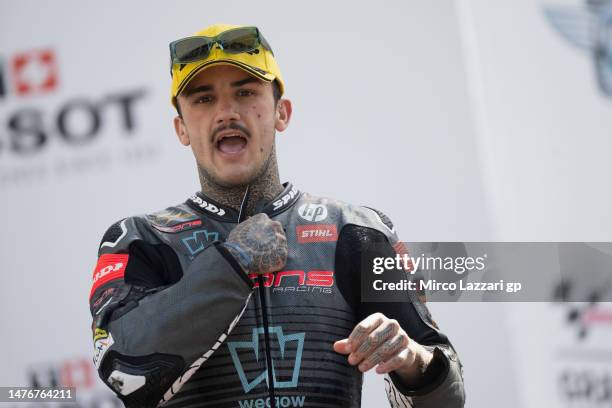 Aron Canet of Spain and Pons Wagon LOS40 celebrates the second place on the podium at the end of the Moto2 race during the MotoGP Of Portugal - Race...