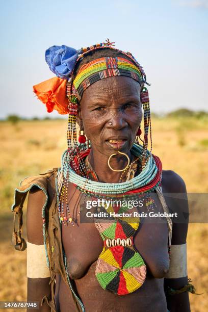 portrait of a toposa woman - scarification stock pictures, royalty-free photos & images