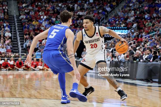 Matt Bradley of the San Diego State Aztecs drives to the basket against Francisco Farabello of the Creighton Bluejays during the first half in the...