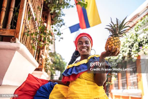 portrait of a palenquera on the street in cartagena, colombia - cartagena stock pictures, royalty-free photos & images