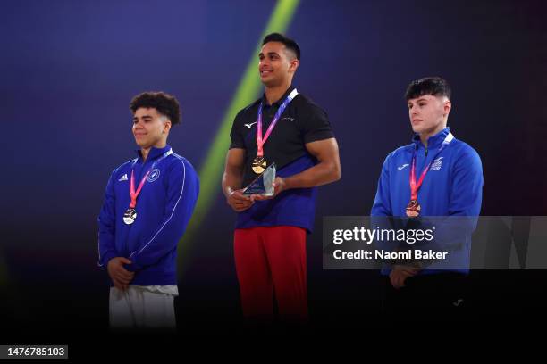 Silver Medalist Jamie Lewis, Gold Medalist Joshua Nathan and Bronze Medalist Jack Stanley celebrate on the podium for pommel Mens Artistic Senior...