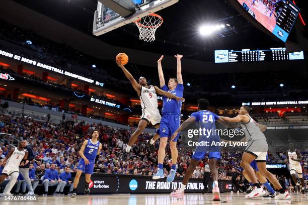 Lamont Butler of the San Diego State Aztecs shoots the ball against Ryan Kalkbrenner of the Creighton Bluejays during the first half in the Elite...