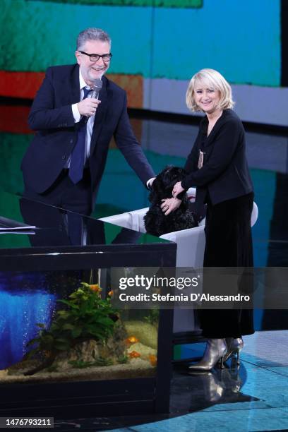 Fabio Fazio, Luciana Littizzetto and her dog Mora attend "Che Tempo Che Fa" Tv Show on March 26, 2023 in Milan, Italy.