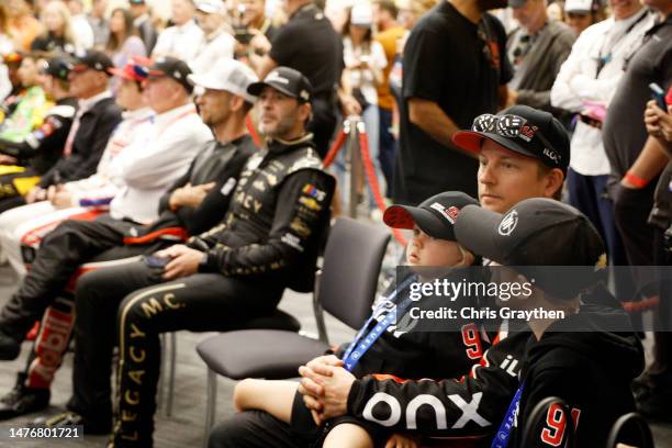 Kimi Raikkonen, driver of the Onx Homes/iLOQ Chevrolet, looks on during the drivers meeting prior to the NASCAR Cup Series EchoPark Automotive Grand...