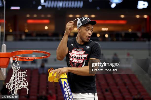 Jaedon LeDee of the San Diego State Aztecs celebrates by cutting down the net after defeating the Creighton Bluejays in the Elite Eight round of the...