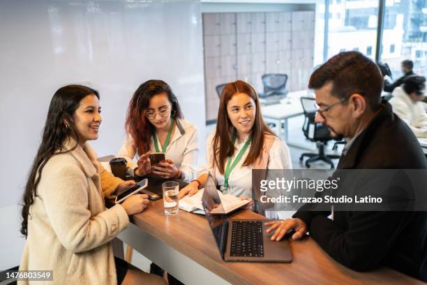 coworkers on a meeting at office - trainee program stock pictures, royalty-free photos & images