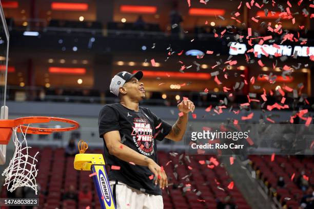 Keshad Johnson of the San Diego State Aztecs celebrates by cutting down the net after defeating the Creighton Bluejays in the Elite Eight round of...