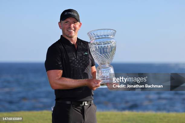 Matt Wallace of England poses with the trophy after winning the Corales Puntacana Championship at Puntacana Resort & Club, Corales Golf Course on...