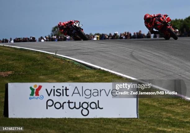 Francesco Bagnaia of Italy and Maverick Viñales of Spain compete during the MotoGP race of the Portuguese Grand Prix at Autodromo do Algarve on March...