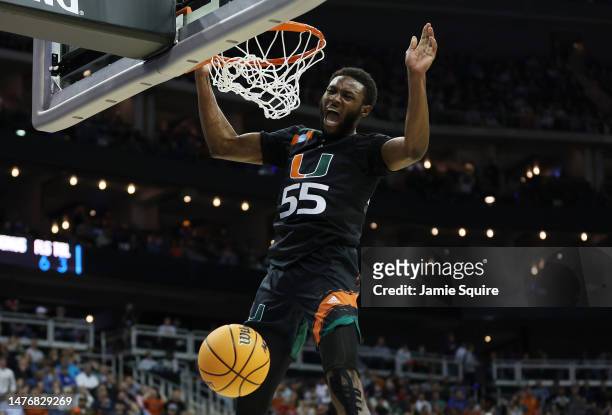 Wooga Poplar of the Miami Hurricanes reacts as he dunks the ball during the second half against the Texas Longhorns in the Elite Eight round of the...
