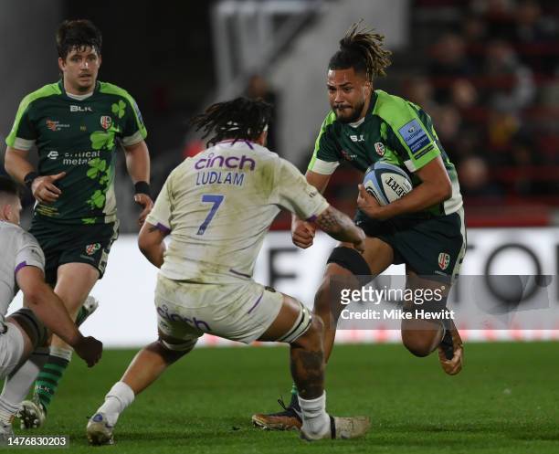 Chandler Cunningham-South of London Irish charges at Lewis Ludlam of Northampton during the Gallagher Premiership Rugby match between London Irish...