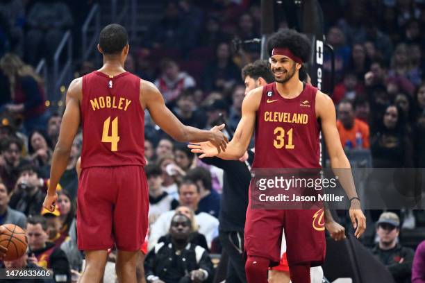 Evan Mobley celebrates with Jarrett Allen of the Cleveland Cavaliers during the first half against the Houston Rockets at Rocket Mortgage Fieldhouse...