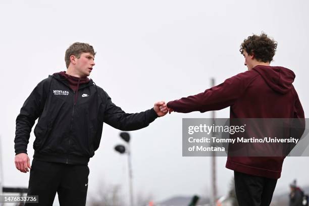 Jay Beagle of the Montana Grizzlies, left, and Cutter Thatcher of the Montana Grizzlies fist bump prior to a race during the Al Manuel Invitational...