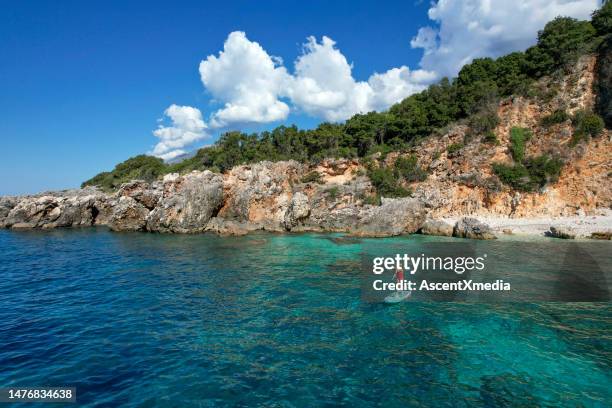 paddle boarding in the adriatic sea - albania adventure stock pictures, royalty-free photos & images