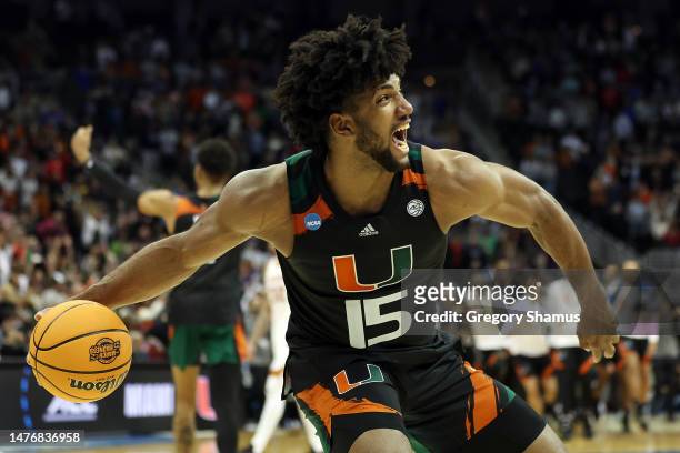 Norchad Omier of the Miami Hurricanes celebrates defeating the Texas Longhorns 88-81 in the Elite Eight round of the NCAA Men's Basketball Tournament...
