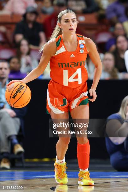 Haley Cavinder of the Miami Hurricanes dribbles the ball against the LSU Lady Tigers during the second quarter in the Elite Eight round of the NCAA...