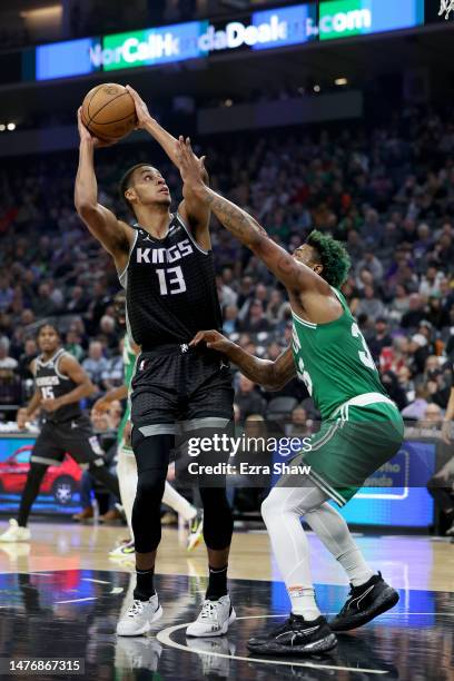 Keegan Murray of the Sacramento Kings goes up for a shot on Marcus Smart of the Boston Celtics at Golden 1 Center on March 21, 2023 in Sacramento,...