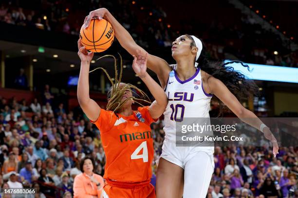 Angel Reese of the LSU Lady Tigers blocks a shot by Jasmyne Roberts of the Miami Hurricanes during the third quarter in the Elite Eight round of the...