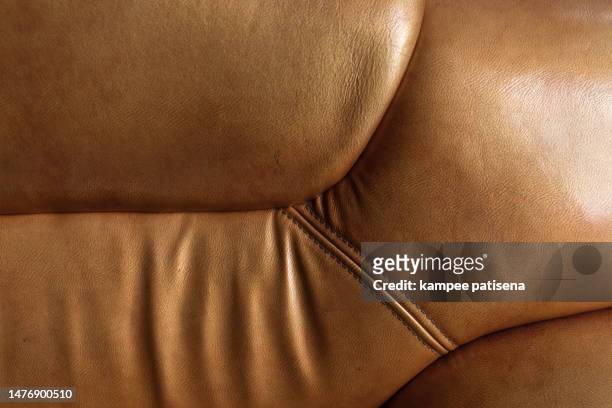 sofa texture. brown antique leather texture pattern background - cushion texture stock pictures, royalty-free photos & images