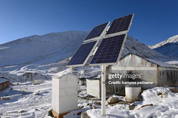 solar panel on a winter with snow mountain - convertible top stock pictures, royalty-free photos & images