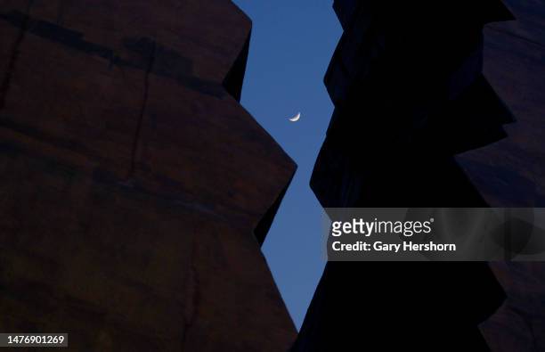 Percent illuminated waxing crescent moon is seen through the Tear Drop 9/11 Memorial on March 26 in Bayonne, New Jersey.