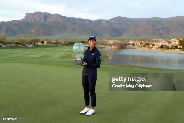 Celine Boutier of France poses with the winners trophy after a playoff win against Georgia Hall of England in the final round of the LPGA Drive On...