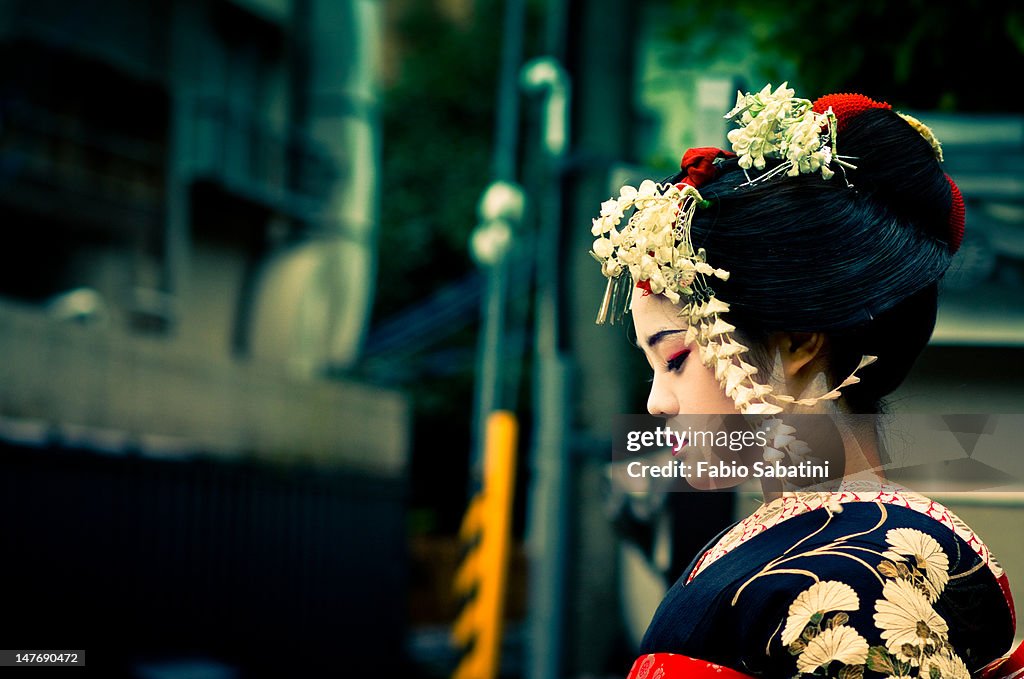 Girl wearing geisha's costume