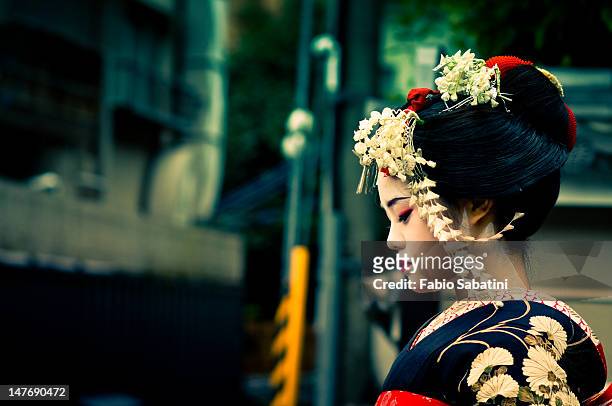 girl wearing geisha's costume - geisha japan stock pictures, royalty-free photos & images