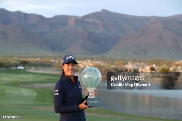 Celine Boutier of France poses with the winners trophy after a playoff win against Georgia Hall of England in the final round of the LPGA Drive On...