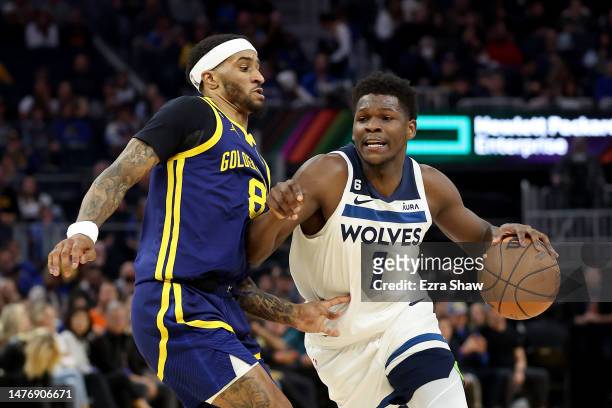 Anthony Edwards of the Minnesota Timberwolves is guarded by Gary Payton II of the Golden State Warriors in the first half at Chase Center on March...