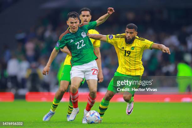 Hirving Lozano of Mexico battles for possession with Adrian Mariappa of Jamaica during the match between Mexico and Jamaica as part of the CONCACAF...