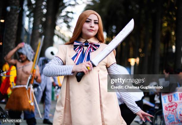 Cosplayer dressed as "M3GAN" poses at WonderCon 2023 at Anaheim Convention Center on March 26, 2023 in Anaheim, California.