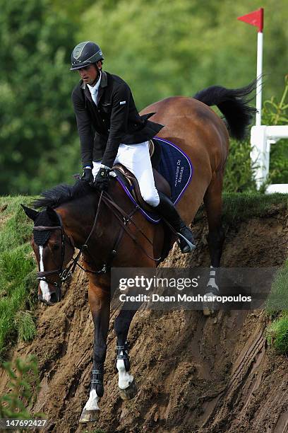 Trevor Breen riding Adventure de Kannan BWP compete in The Carpetright Derby during the British Jumping Hickstead Derby Meeting on June 24, 2012 in...