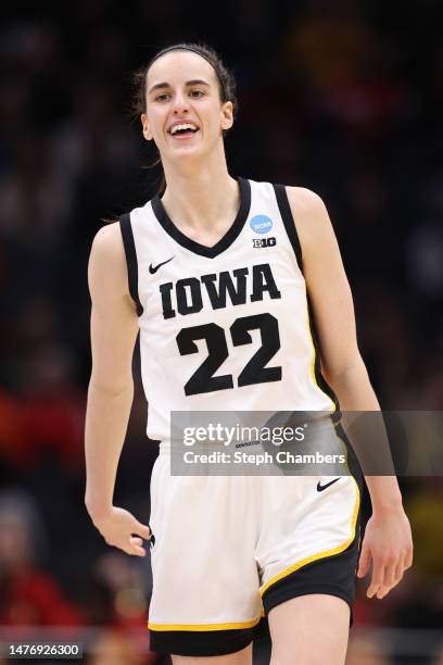 Caitlin Clark of the Iowa Hawkeyes reacts during the third quarter against the Louisville Cardinals in the Elite Eight round of the NCAA Women's...