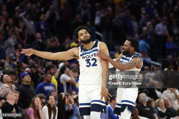 Karl-Anthony Towns Mike Conley of the Minnesota Timberwolves react after Towns hit the game-winning shot against the Golden State Warriors at Chase...