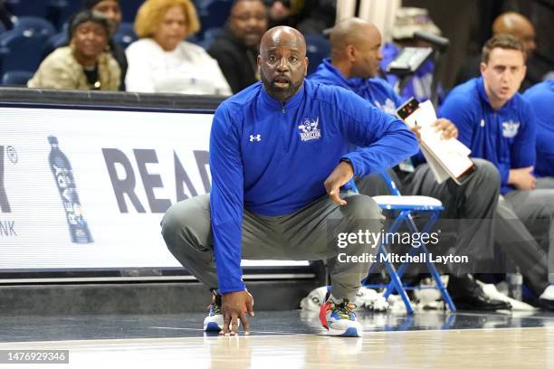 Head coach Edward Joyner of the Hampton Pirates looks on during The CAA Men's Basketball Tournament- First Round game against the Monmouth Hawks at...