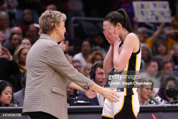 Head coach Lisa Bluder and Caitlin Clark of the Iowa Hawkeyes celebrate after defeating the Louisville Cardinals in the Elite Eight round of the NCAA...