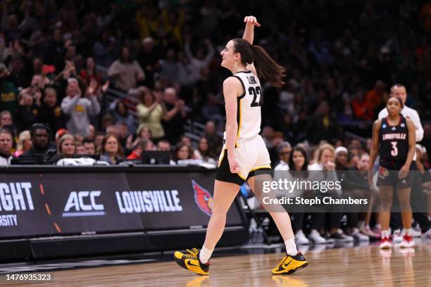 Caitlin Clark of the Iowa Hawkeyes reacts during the fourth quarter against the Louisville Cardinals in the Elite Eight round of the NCAA Women's...