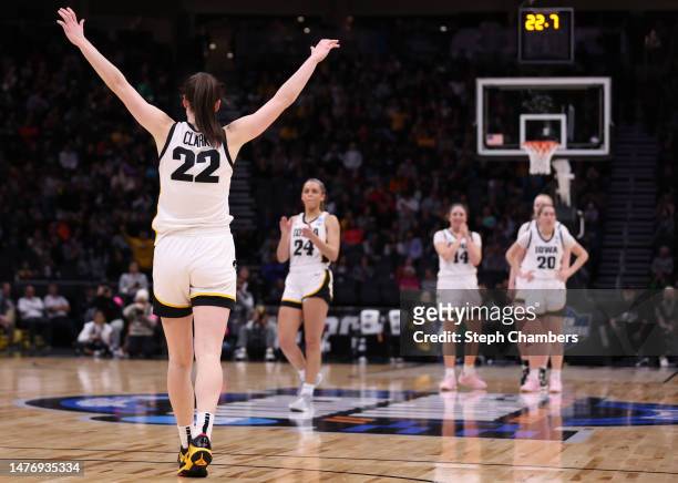 Caitlin Clark of the Iowa Hawkeyes reacts during the fourth quarter against the Louisville Cardinals in the Elite Eight round of the NCAA Women's...