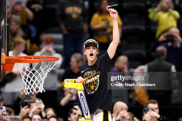 Caitlin Clark of the Iowa Hawkeyes celebrates after defeating the Louisville Cardinals 97-83 in the Elite Eight round of the NCAA Women's Basketball...