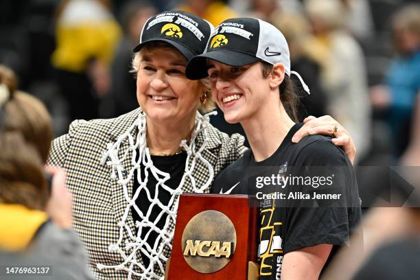 Head coach Lisa Bluder and Caitlin Clark of the Iowa Hawkeyes pose for a photo after defeating the Louisville Cardinals 97-83 in the Elite Eight...