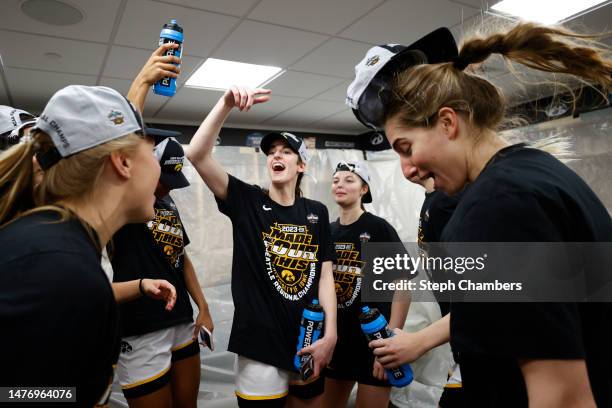 Caitlin Clark of the Iowa Hawkeyes celebrates after defeating the Louisville Cardinals 97-83 in the Elite Eight round of the NCAA Women's Basketball...