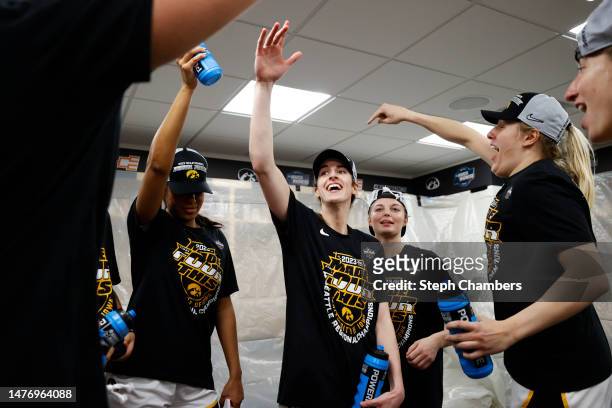 Caitlin Clark of the Iowa Hawkeyes celebrates after defeating the Louisville Cardinals 97-83 in the Elite Eight round of the NCAA Women's Basketball...