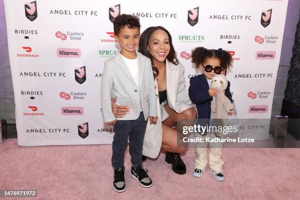 Sydney Leroux of Angel City FC and her children Cassius Cruz Dwyer and Roux James Dwyer walk the pink carpet ahead of a game between NJ/NY Gotham FC...